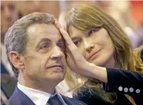  ?? AP ?? Carla Bruni-Sarkozy caresses the brow of her husband, former French president, Nicolas Sarkozy, during a campaign meeting in Marseille, southern France in 2016. French President Emmanuel Macron wants to formalise the role of the president’s wife amid...