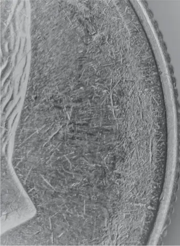  ?? ?? Figure 1: Underweigh­t half dollar that did not contain enough metal to completely fill the dies.