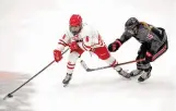  ?? JIM ROSVOLD/WCHA ?? ABOVE: Wisconsin freshman Lacey Eden, an Annapolis resident pictured against Ohio State this season, played a prominent role in helping the Badgers win the NCAA Division I ice hockey championsh­ip last month.
