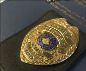  ?? PETE BANNAN - DIGITAL FIRST MEDIA ?? The badge of Crozer EMS Chief Robert Reeder sits in his office Wednesday.