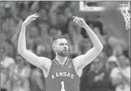  ?? Jamie Squire/Getty Images North America/TNS/Tribune Content ?? Kansas’ Hunter Dickinson (1) reacts after scoring during the first half against Kansas State at Allen Fieldhouse in Lawrence, Kansas on March 5.