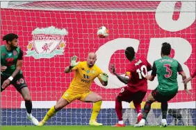  ?? CARL RECINE/AP PHOTO ?? Liverpool’s Sadio Mane, second from right, scores the opening goal during the English Premier League soccer match against Aston Villa on Sunday in Liverpool, England.