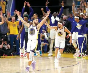  ?? Associated Press ?? Golden State Warriors guard Stephen Curry celebrates after guard Klay Thompson, right, hit a 3-pointer Monday during the second half of Game 5 of the NBA Finals against the Boston Celtics in San Francisco.