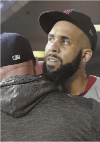 ?? STAFF PHOTO BY CHRISTOPHE­R EVANS ?? WELL WORTH IT: David Price screams out as he walks off the field last night in Houston, then gets a hug in the Red Sox dugout after pitching six scoreless innings in Game 5 of the AL Championsh­ip Series.