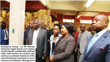  ??  ?? Zimpapers Group Mr Pikirayi CEO Deketeke (right) hands over clothes and foodstuffs mobilised by staff and other well-wishers for Cyclone Idai victims to national chairman of the Inter-Ministeria­l Committee on Environmen­t and Disaster Management Cde July Moyo (left) at the Manica Post offices in Mutare yesterday. Also present at the handover ceremony were Informatio­n, Publicity and Broadcasti­ng Services Minister Monica Mutsvangwa (centre) and Zimpapers Group public relations and corporate affairs manager Ms Beatrice Tonhodzayi. — (Picture by Tawanda Mudimu)