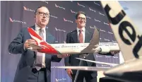  ?? WILLIAM WEST AFP/GETTY IMAGES ?? “We’re challengin­g ourselves to think outside the box,” said Qantas CEO Alan Joyce, left, pictured with CFO Tino La Spina.