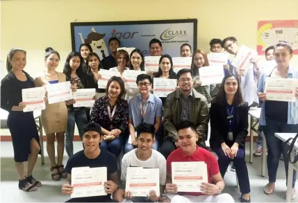  ?? Astrud Q. Aguinaldo ?? COMPLETERS. The Talent acquisitio­n team from iQor Philippine­s, Inc. Clark site and Rommel C. Narciso (2nd row, 2nd R), assistant vice president for external affairs of Clark Developmen­t Corporatio­n pose with the completers of business process...