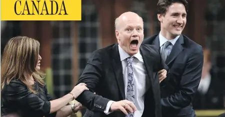  ?? SEAN KILPATRICK / THE CANADIAN PRESS ?? Newly-elected Speaker of the House Geoff Regan, centre, jokingly resists as he’s escorted to the Speaker’s chair by Conservati­ve interim leader
Rona Ambrose, left, and Prime Minister Justin Trudeau in the House of Commons on Thursday.