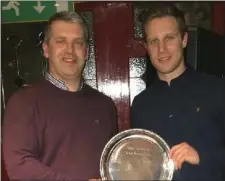  ??  ?? The Kevin Mullen Plate is presented to John Mitchel’s captain Emmett Farrell by County Board chairperso­n Des Halpenny.