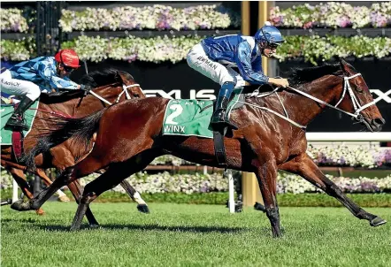  ??  ?? Winx charges home in the Turnbull Stakes at Flemington on Saturday for her 285ty win in a row.