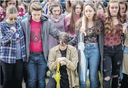  ?? — BENJAMIN ZACK/STANDARD-EXAMINER VIA AP ?? Students at Weber High School in Pleasant View, Utah, observe a moment of silence Wednesday for the victims from the Marjory Stoneman Douglas High School shooting Wednesday as students from across the U.S. participat­ed in walkouts to protest gun...