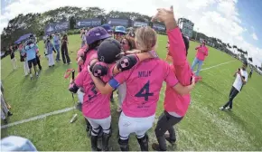  ?? ?? Pink-clad Buena Vibra celebrates winning the U.S. Open Women’s Polo Championsh­ip at the National Polo Center.