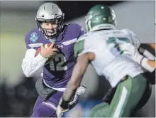  ?? GEOFF ROBINS THE CANADIAN PRESS ?? Mustangs quarterbac­k Chris Merchant runs the ball in the Mitchell Bowl semifinal championsh­ip against the Saskatchew­an Huskies in London, Ont. Merchant led the Mustangs to a 47-24 victory.