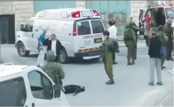  ?? (B’Tselem) ?? A STILL PHOTO from the famous video shows Sgt. Elor Azaria shooting an incapacita­ted terrorist in Hebron on March 24, 2016.