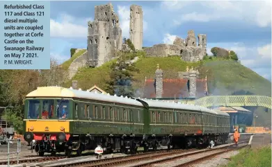  ?? P. M. WRIGHT. ?? Refurbishe­d Class 117 and Class 121 diesel multiple units are coupled together at Corfe Castle on the Swanage Railway on May 7 2021.