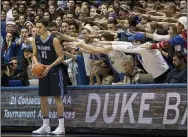  ?? BEN MCKEOWN — THE ASSOCIATED PRESS ?? Maine’s Ilija Stojiljkov­ic looks to inbound the ball as the Cameron Crazies shout from behind during a game against Duke in Durham, N.C. on Dec. 3, 2016.