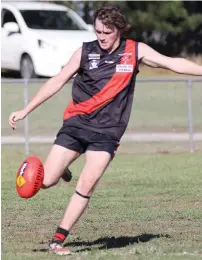  ??  ?? Nilma-Darnum player Thomas Campbell moves the Bombers into attack.