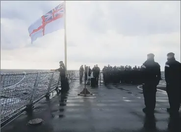  ?? ?? TRIBUTE Commander George Storton prepares to place a wreath over the wreck of HMS Ark Royal