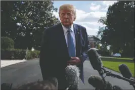  ?? The Associated Press ?? SOUTH LAWN: President Donald Trump talks to reporters on the South Lawn of the White House, Friday, in Washington.