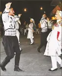  ??  ?? Folk dancers perform at the Tuzla Festival