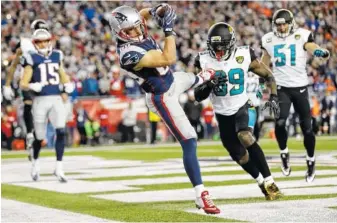  ?? THE ASSOCIATED PRESS ?? New England Patriots wide receiver Danny Amendola catches a touchdown pass in front of Jacksonvil­le Jaguars safety Tashaun Gipson and linebacker Paul Posluszny during the AFC championsh­ip game Sunday in Foxborough, Mass. Amendola has had a knack for...