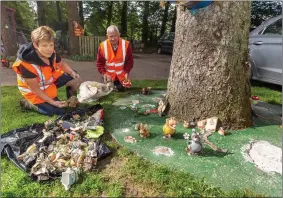  ??  ?? Catherine Murphy and Michael Burns surveying the damage caused by vandals to the Tiny Feet Fairy Garden in Macroom on Monday evening.