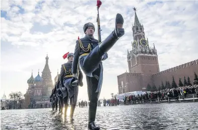  ?? MLADEN ANTONOV / AFP / GETTY IMAGES FILES ?? Honour guards march in Moscow in November as Russia marked the 77th anniversar­y of the 1941 historical parade, when Red Army soldiers marched to the front line to fight Nazi Germany troops in the Second World War.