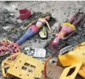  ?? THE ASSOCIATED PRESS ?? Burnt dolls lie in a yard of a destroyed house in Mati, Greece, on Thursday.
