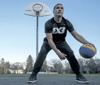  ?? LIAM RICHARDS/THE CANADIAN PRESS ?? Michael Linklater, who is playing in the FIBA 3x3 World Tour Final in Beijing later this week, stands for a photograph at a outdoor basketball court near his home in Saskatoon, Tuesday. Linklater has been the top-ranked 3-on-3 player in Canada for...