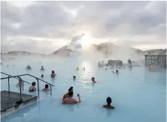  ?? ARNALDUR HALLDORSSO­N / BLOOMBERG FILES ?? Tourists flock to Iceland for getaways such as this spa in Grindavik, but this industry is cooling fast.