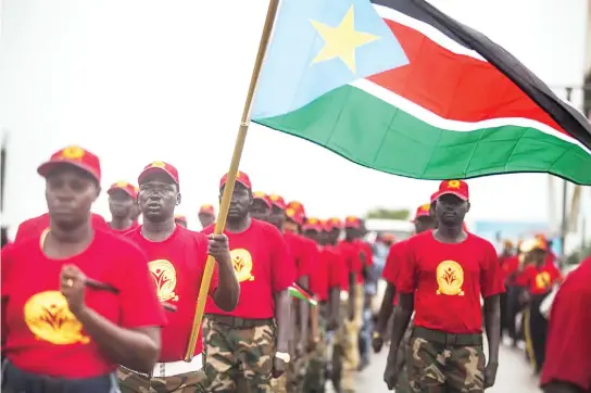  ??  ?? Members of the Red Army Foundation march on the streets of Juba to commemorat­e Sudan’s 6th independen­ce anniversar­y. (AFP)