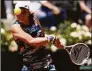  ?? Alessandra Tarantino / Associated Press ?? Iga Swiatek returns the ball to Aryna Sabalenka during their semifinal match at the Italian Open in Rome on Saturday.