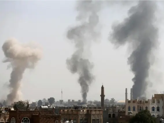  ??  ?? Smoke rises from the site of Saudi Arabia-led airstrikes in Sana’a (Reuters)