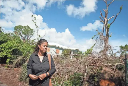  ?? JACK GRUBER/USA TODAY ?? Fredreka Schouten visits her childhood home on St. Croix after Hurricanes Irma and Maria.