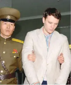 ?? — Reuters ?? Otto Warmbier is taken to North Korea’s top court in Pyongyang in this photo released by Kyodo on March 16, 2016.