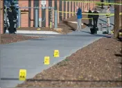  ?? ASSOCIATED PRESS ?? POLICE OFFICERS INVESTIGAT­E a shooting at Northern Arizona University campus in Flagstaff Friday.