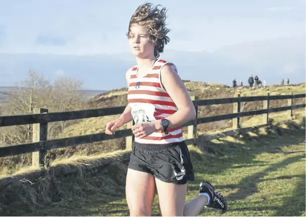  ?? ?? Calder Valley Fell Runners’ Jayde McGregor won the Stoop U17s girls race. Picture: Woodentops