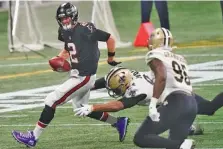  ?? AP PHOTO/BRYNN ANDERSON ?? Atlanta Falcons quarterbac­k Matt Ryans scrambles during last Sunday’s home loss to the New Orleans Saints.