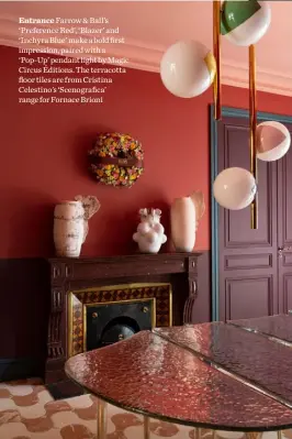  ??  ?? Entrance Farrow & Ball’s ‘Preference Red’, ‘Blazer’ and ‘Inchyra Blue’ make a bold first impression, paired with a ‘Pop-Up’ pendant light by Magic Circus Éditions. The terracotta floor tiles are from Cristina Celestino’s ‘Scenografi­ca’ range for Fornace Brioni