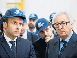  ?? Foto: Reuters ?? Soll die Eurozone vertieft werden, müssen Frankreich­s Staatschef Emmanuel Macron (li.) und EU-Kommission­spräsident Jean-Claude Juncker erst einmal eine harte Nuss namens Angela Merkel knacken.