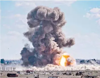  ?? — AFP ?? Smoke and fire billow after shelling on the IS group’s last holdout of Baghouz, in the eastern Syrian Deir Ezzor province, on Sunday.