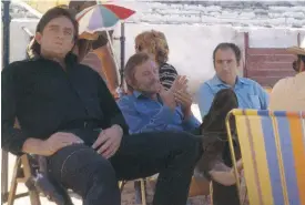  ??  ?? Johnny Cash, Kirk Douglas and Saul Holiff on the set of A Gunfight in Spain in 1970.