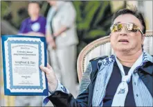  ?? Tom Donoghue ?? Roy Horn is shown with a proclamati­on from Rep. Dina Titus during a celebratio­n of Siegfried & Roy’s SARMOTI Cubs Day on Oct. 15, 2015.