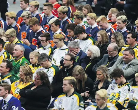  ?? MICHELLE BERG ?? Humboldt Broncos president Kevin Garinger, centre, attends Evan Thomas’ funeral at SaskTel Centre on Monday.