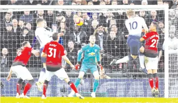  ??  ?? Manchester United’s Spanish goalkeeper David de Gea (C) watches as Tottenham Hotspur’s English striker Harry Kane (2R) heads the ball but fails to score during the English Premier League football match between Tottenham Hotspur and Manchester United at Wembley Stadium in London, on January 13, 2019. - AFP photo