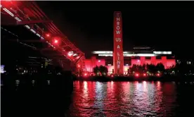  ??  ?? Tate Modern is lit up in red to highlight the effects of the pandemic on the arts. Photograph: Getty