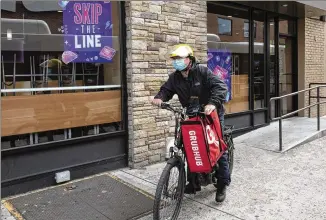  ?? MARK LENNIHAN/AP 2021 ?? Doordash, Grubhub and Uber Eats sued New York over a separate bill capping fees delivery companies can charge restaurant­s. Doordash and Grubhub are also suing San Francisco over its fee caps.