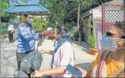  ?? AMAL KS/HT PHOTO ?? A resident submits to thermal screening at Mandakini Enclave on n
Sunday.