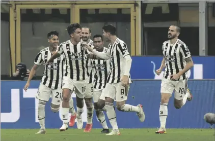  ?? AP PHOTO/LUCA BRUNO ?? Juventus’ Paulo Dybala (left) celebrates after scoring his side’s opening goal during a Serie A soccer match between Inter Milan and Juventus at the San Siro stadium in Milan, Italy, on Sunday.