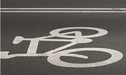  ?? Photograph: Tim de Waele/Getty Images ?? The bicycle the younger man was riding did not match the color of the one purported to be stolen.